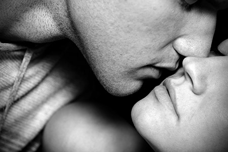 Woman and man kissing